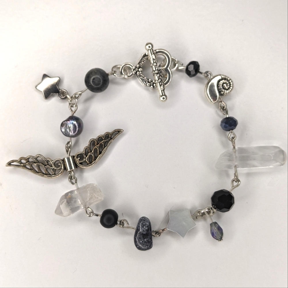 Bracelet with charms toggle clasp and stars color is black/gray. Handmade by me.